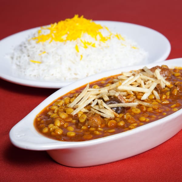 Farsi Cafe's Gheimeh stew with split peas, meat, and crispy potato sticks, served with saffron rice.