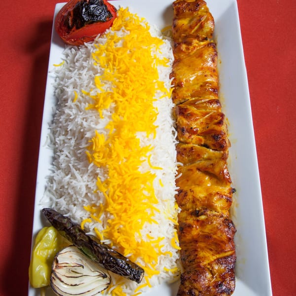 Farsi Cafe's chicken shish kebab with saffron rice, grilled tomato, onion, and pepper.